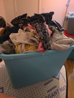Totes  of baby  girl and boy clothing
