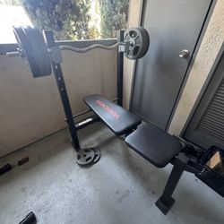 Weight Bench, Curl Bar And One Inch Weights