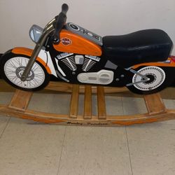 This is a Charm Company Harley-Davidson Roaring Softail Rocker, a children's rocking toy designed to resemble a Harley-Davidson motorcycle. It is made