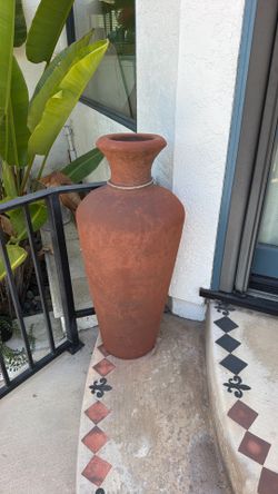 Tall clay decorative pot
