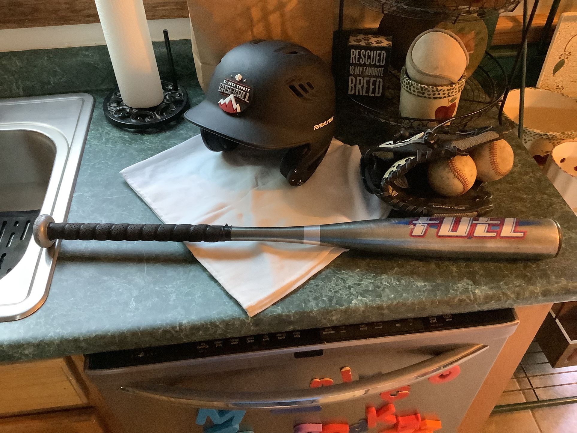 Baseball equipment package including Franklin 10.5” baseball glove model 4626, Rawlings like new batting helmet size 6 3/8” to 7 1/8” 2 baseballs Rawl