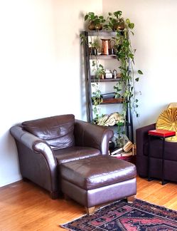 Comfy brown leather chair with ottoman