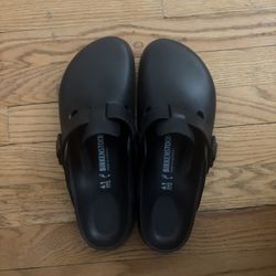 Black Plastic Birkenstock Clogs.