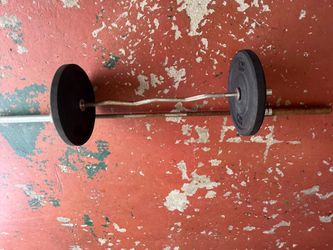 Olympic bar and Olympic bar with 25 pound bumper plates