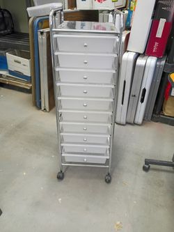 Rolling metal craft cart with 10 White plastic drawers great condition hash only please