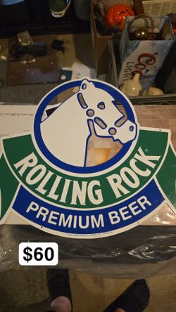 Rolling rock wall sign