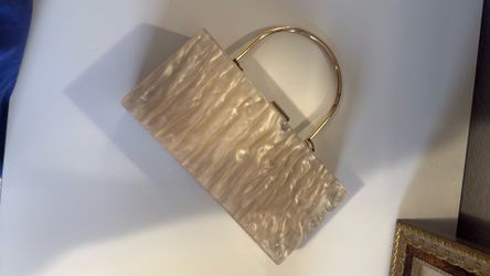ASOS DESIGN marble clutch bag with metal handle