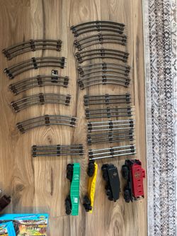 O Gauge Railroad Tracks and Railcars.