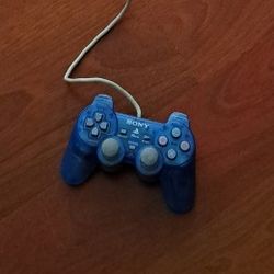 Clear blue Sony Playstation 1 /Playstation 2 controller. 