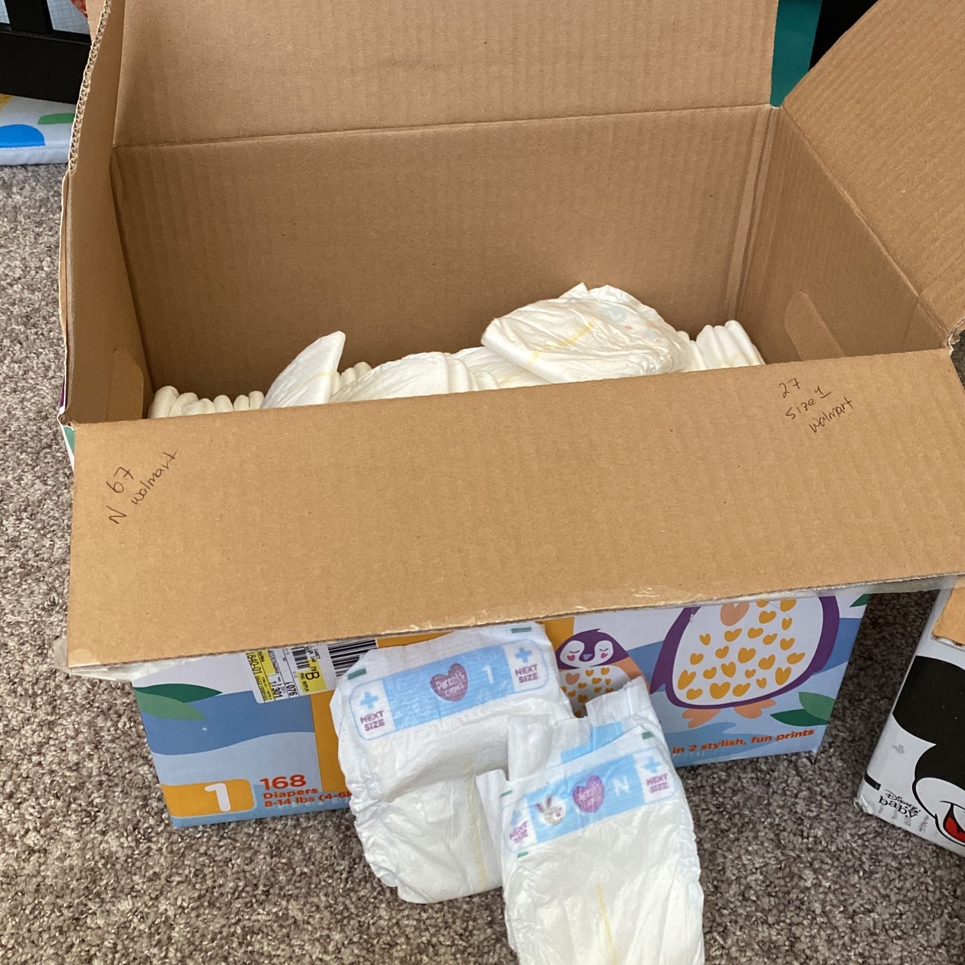 Newborn And Size 1 diapers 