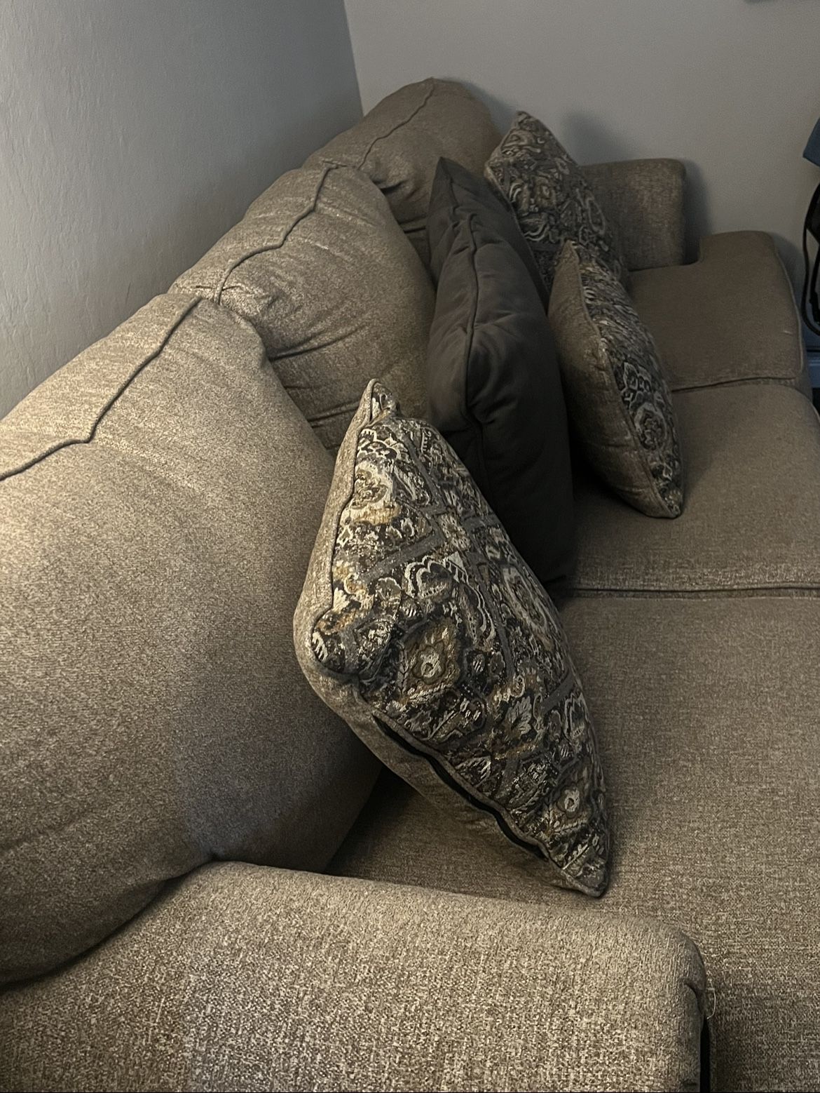 Tan sofa with decorative pillows