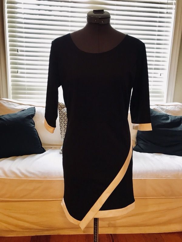Women’s size small black with white piping dress. Business to evening.New w/o tags.