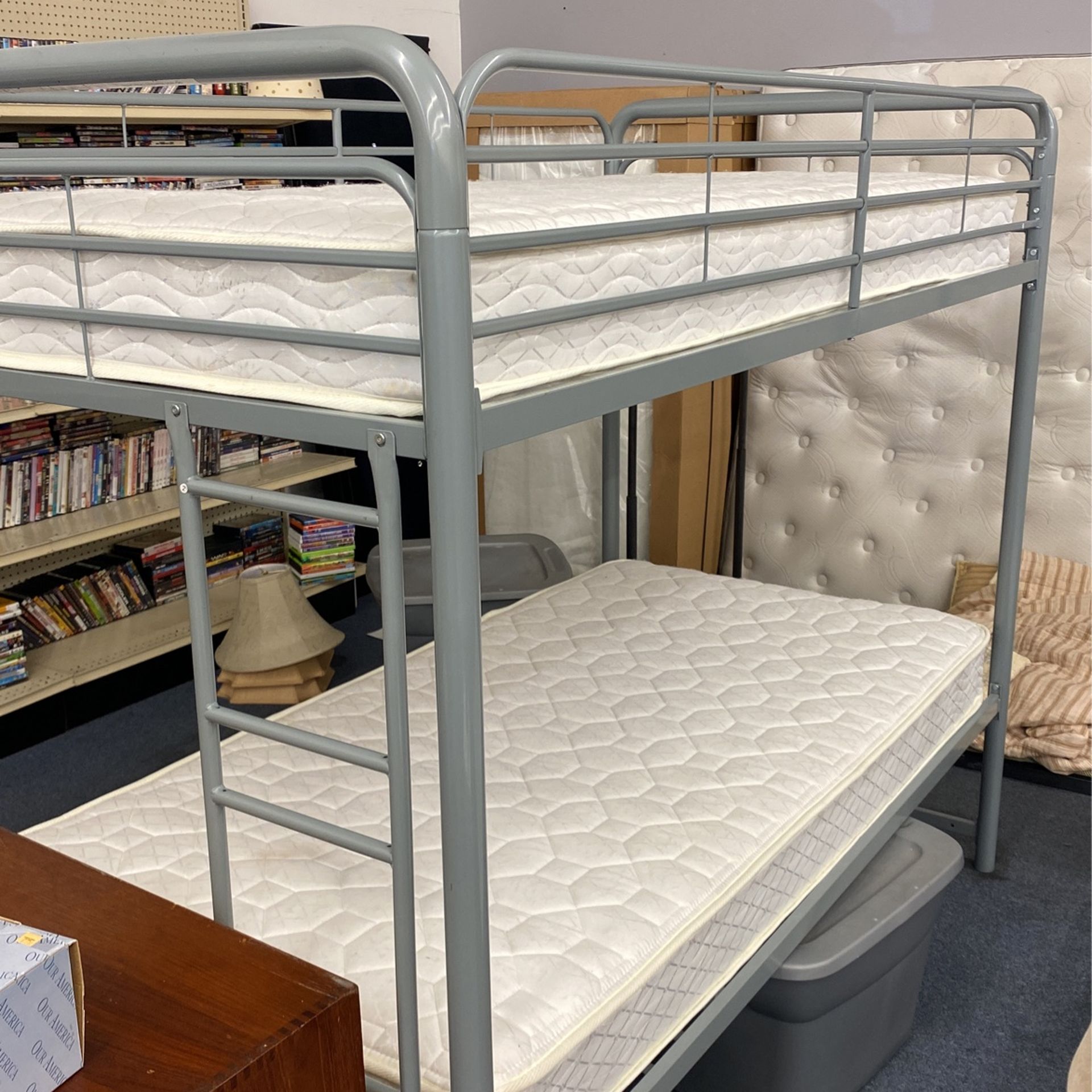 Twin over twin bunk bed in Escalon shape includes mattresses