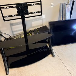 Quality Tv Stand And 65inch Sony Tv (working)