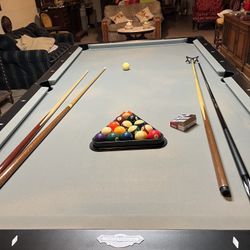 Regulation Pool Table With Some Sticks, The Cues And Chalk