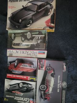5 opened boxes of model kits