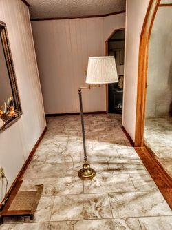 Gold-Colored Floor Lamp With Off-White Shade