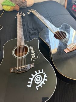 Takamine 12 string and Jasmine 6 string guitar