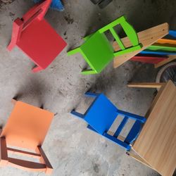 Two Daycare Tables With 4 Chairs Each And Book Holders 