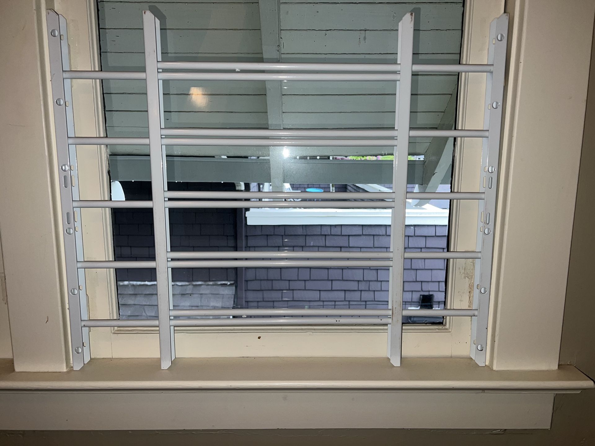 Adjustable window grate