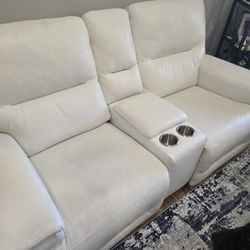 Two Powered Recliners With Center Console. 