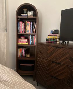 Brown arched bookcase