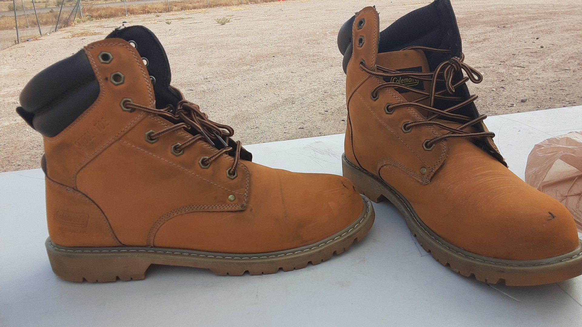 Size 12 coleman work boots they have a small tear in front