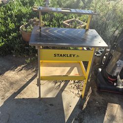 Stanley Jr. Kids Wood Work Bench designed for children aged 5 to 12 years old to engage in imaginative play and educational woodworking activities.