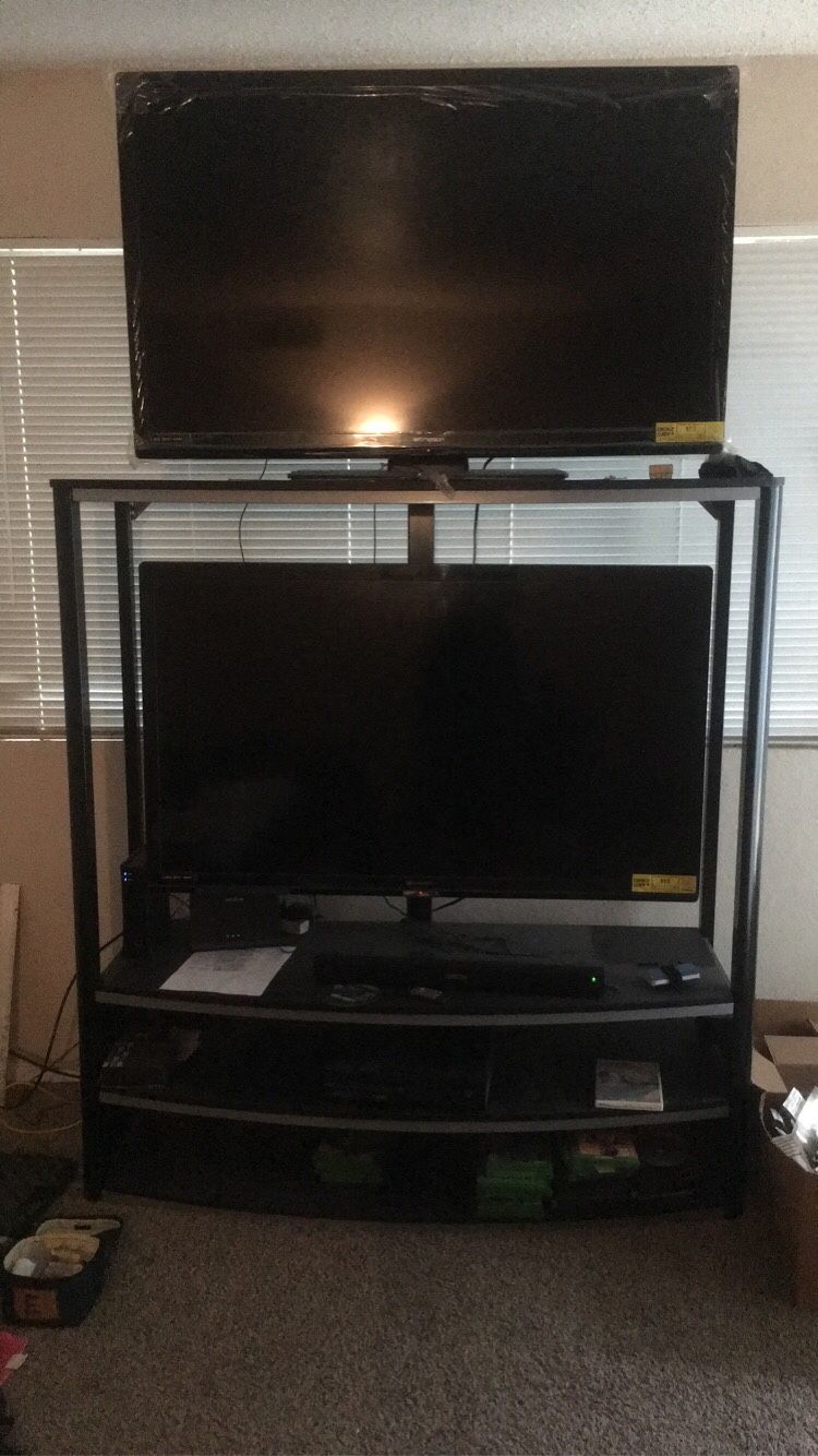 I’m selling my 2 50in tvs and the stand...