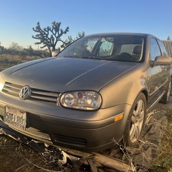 Metallic VW GTI, 2 door, 1.8 turbo, manual transmission.