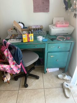 Desk and rolling chair