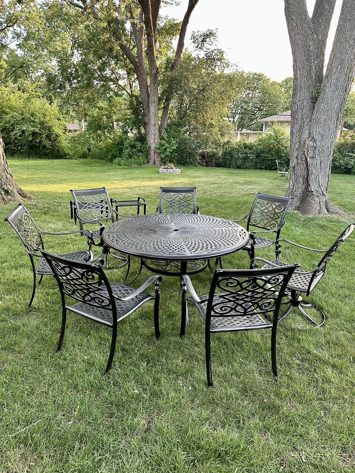 Large Cast Aluminum 10pc Patio Set, Table Is 60” Diameter, 7 Chairs, 2 Of Them Are Swivel, 2 Foot Ottomans, Freshly Painted, Looks Like New