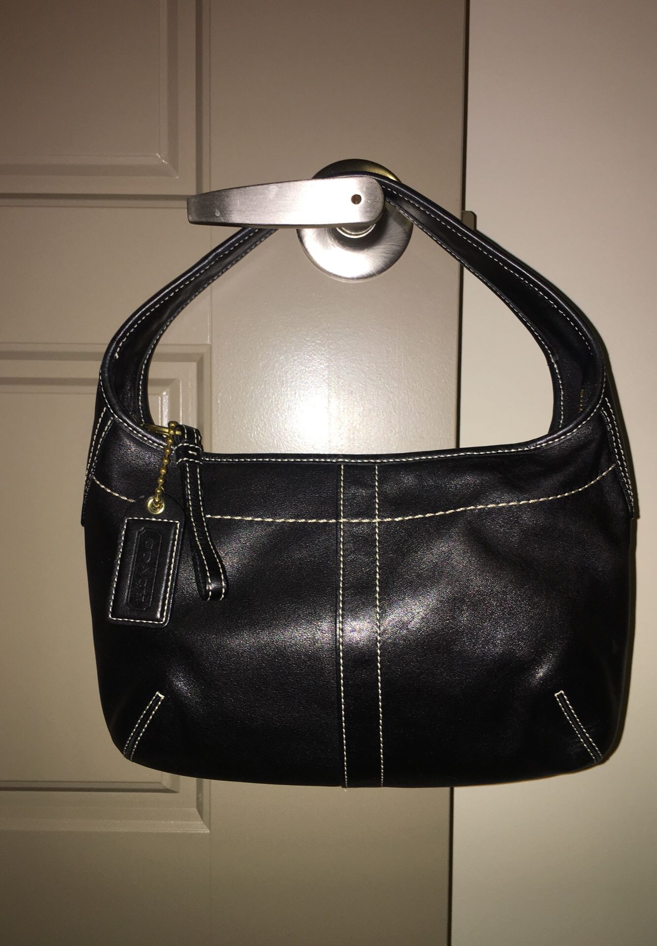 Coach small black leather purse with white stitching