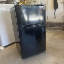GE Mini fridge with freezer. Works great!
