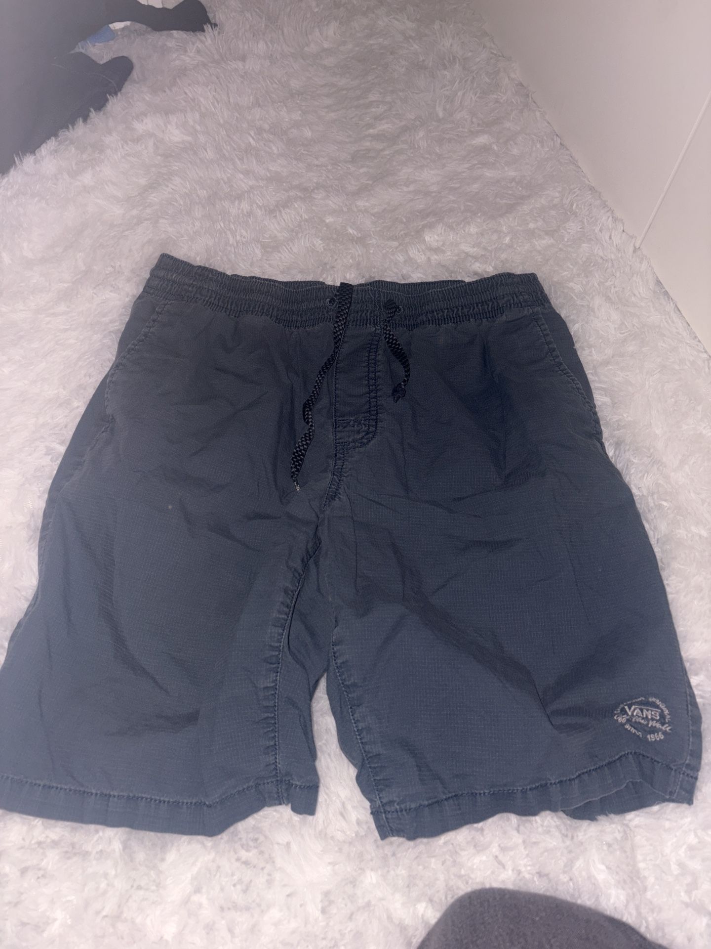 MEDIUM SIZED NAVY BLUE  VANS SHORTS 