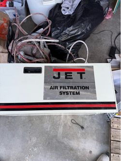 This is a JET AFS-1000B ceiling-mounted air filtration system designed for workshops