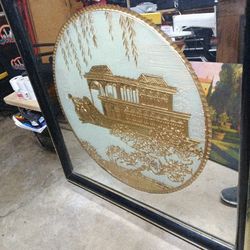 This is a Chinoiserie gilded carving and eglomise wall mirror featuring the Marble Boat at the Summer Palace in Beijing, China. 
