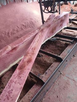 Freshly Cut Pink/Red Hardwood Lumber Slabs