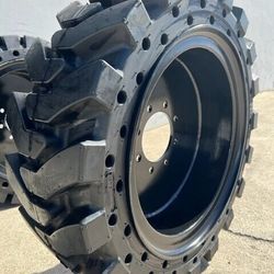 New Each 12-16.5 Skid Steer Solid Tires Mounted On 8 Lug Wheel
