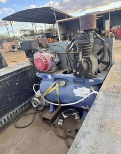 Utility bed with lift gate and air compressor