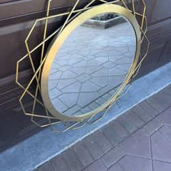 Brown Mirror With A Brass Trim