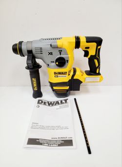 DEWALT 20V MAX XR brushless rotary hammer has a 1-1/8 inch SDS Plus chuck. This yellow and black tool is the DCH293 model and includes the original in
