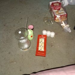 Three Small White Candles 10 Tiki Light Candles And Two Other Candles That Haven't Been Used And One That Has A Oil