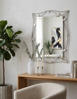 Elegant Metal Frame Mirror with Floral Accent Good Condition Good Quality