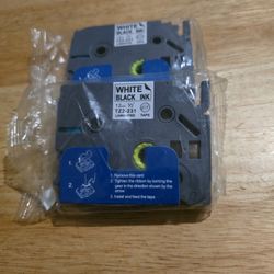 Two Brother P-touch laminated label tapes with black ink