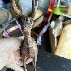 vintage hand-carved wooden deer sculpture