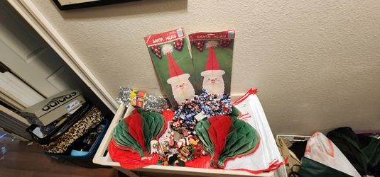 Huge lot of vintage christmas items,foil garland,Silver garland,9 huge plastic stockings,denmark santa head table centerpieces, paper hanging ornament