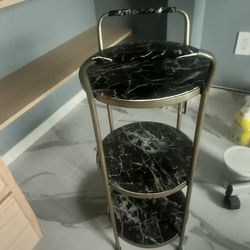 Round side table with three shelves