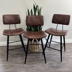 24.5" Counter Height Bar Stools Set of 3, Red Brown Faux Leather Upholstered Barstools with Back Footrest and Metal Legs, Armless Bar Chairs for Kitch