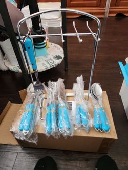 Blue Handle Stainless Steel Flatware Set 4 of each set an stand